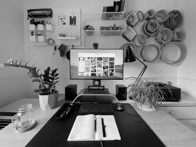 A photo of my desk setup, including a Mac mini, Dell monitor, Anglepoise lamp, and my IKEA Bekant sit-stand desk.